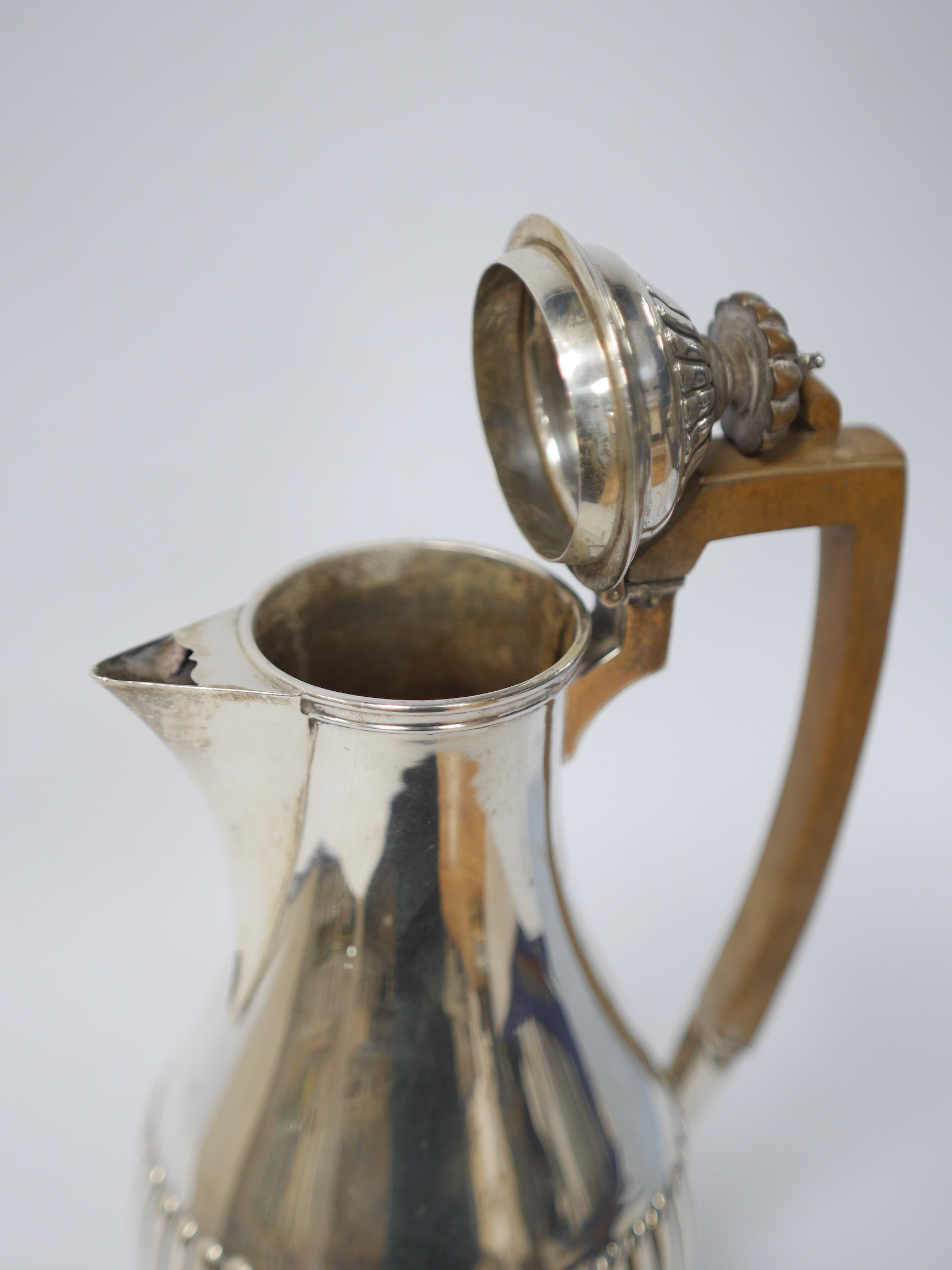 A Victorian demi-fluted silver hot water pot by Charles Stuart Harris, London, 1891, 22.3cm, gross weight 13.4oz. Condition - fair